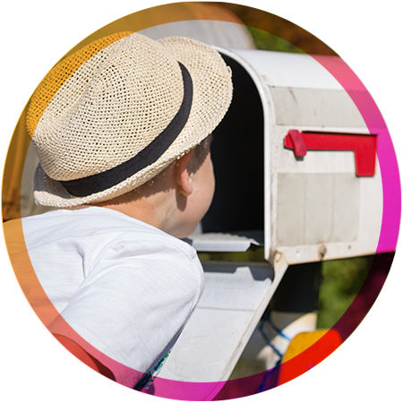 A child looking in a mailbox